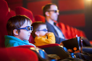 father and sons in 3d cinema (shuttertsock, Tomsickova Tatyana )
